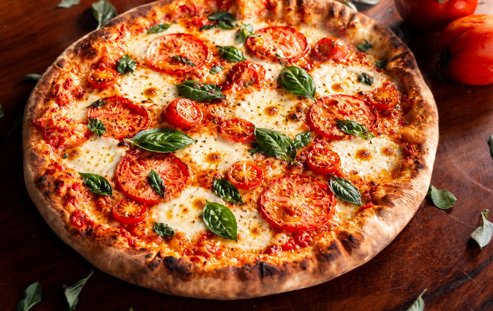 Margherita pizza with tomatoes, basil and melted mozzarella